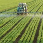 photo-farming-tractor-spread-fertilizer-pesticide