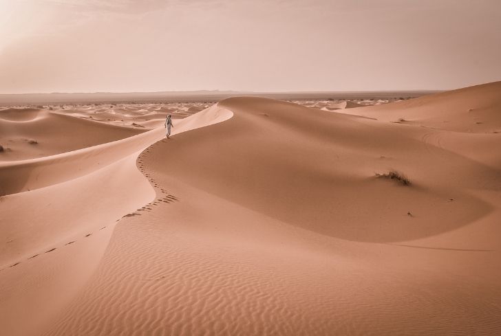 man-walking-alone-in-desert