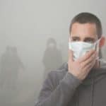 man-wearing-mask-in-air-pollution