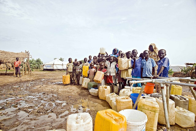 children-and-women-in-line-for-water-crisis-shortage