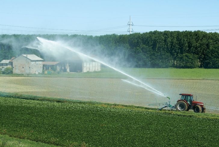 tractor-irrigating-watering-field